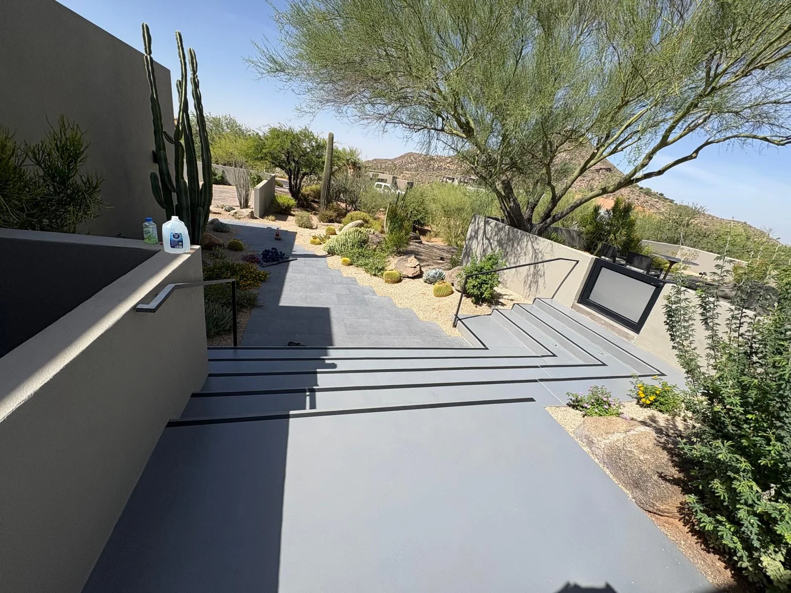 Finished concrete steps and walkway in a desert landscape